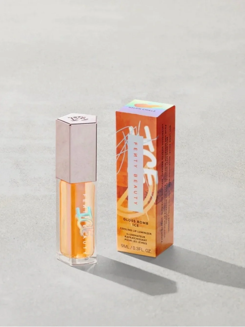 FENTY BEAUTY GLOSS BOMB ICE COOLING LIP LUMINIZER COLOR: MELON CHILLZ